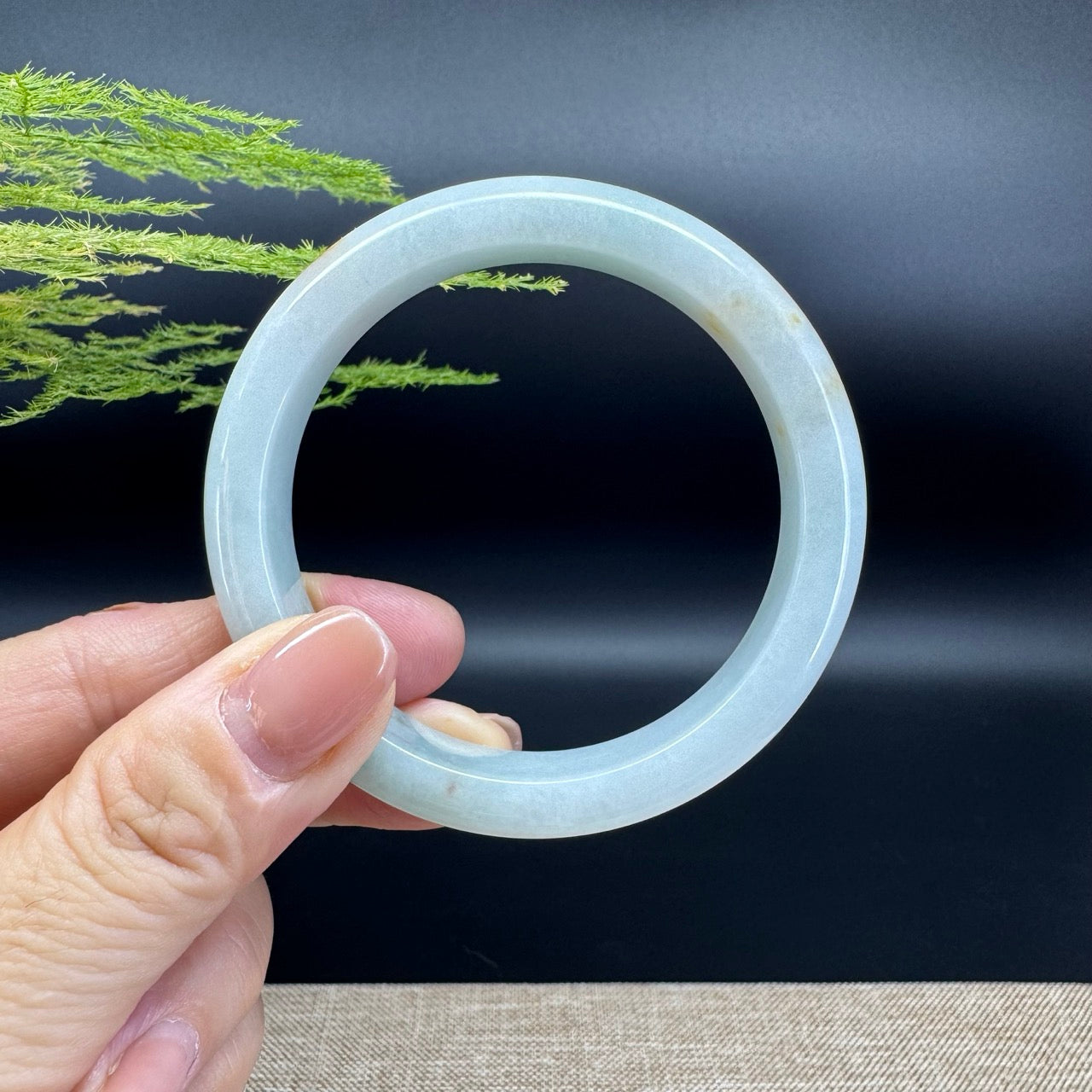 The bangle shape of the half round.The bangle color is icy green.