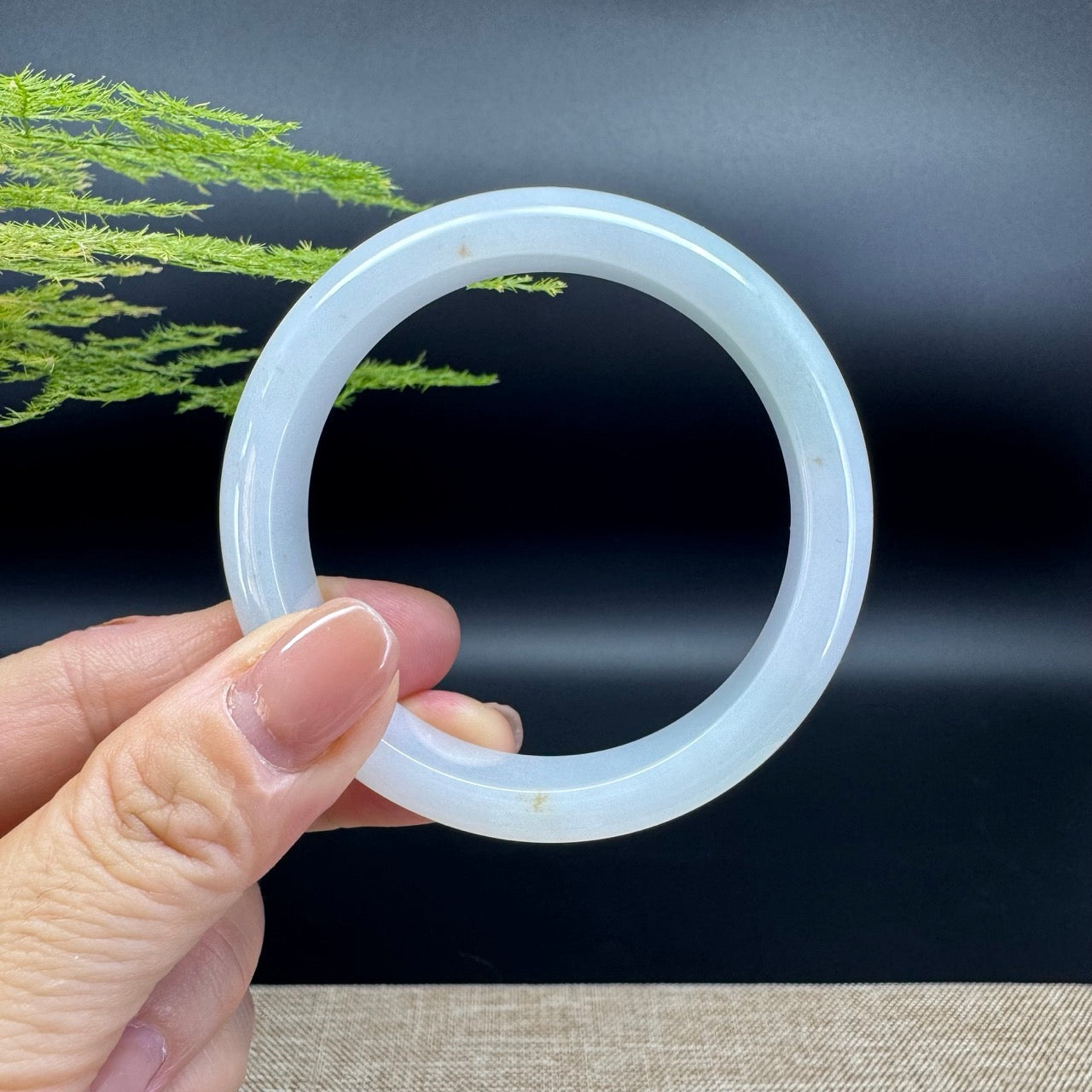The bangle shape of the half round.The bangle color is icy green.