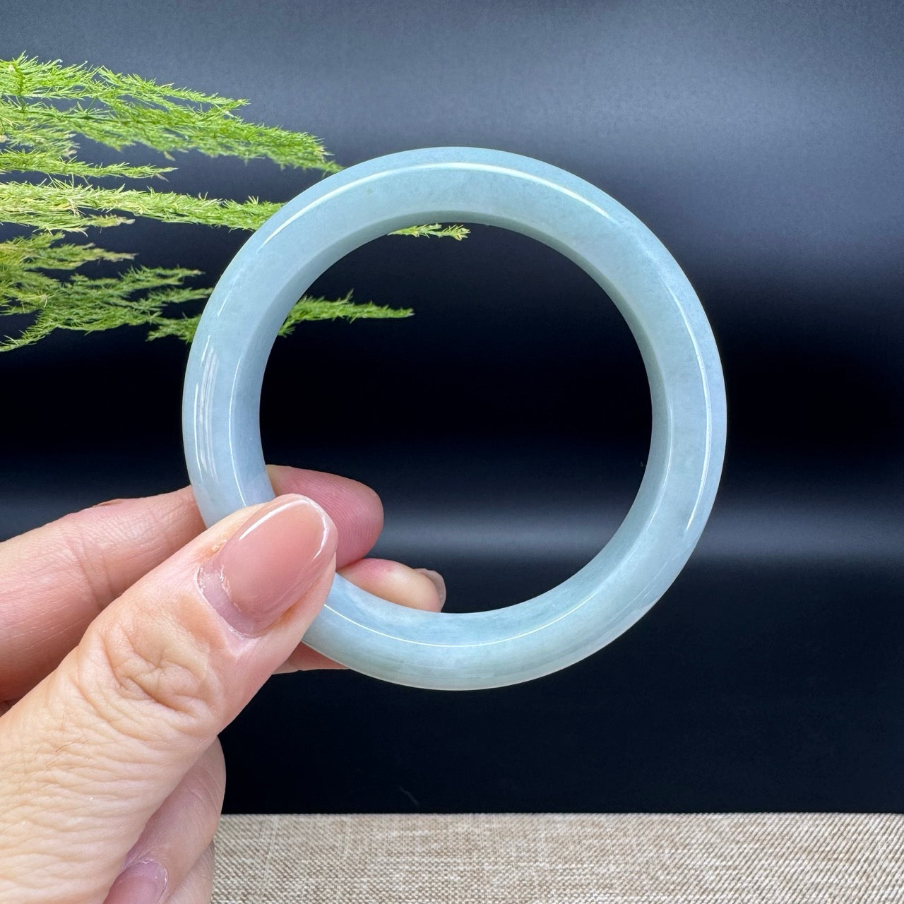 The bangle shape of the half round.The bangle color is green.