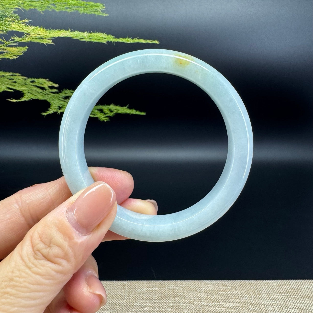 The bangle shape of the half round.The bangle color is yellow green.