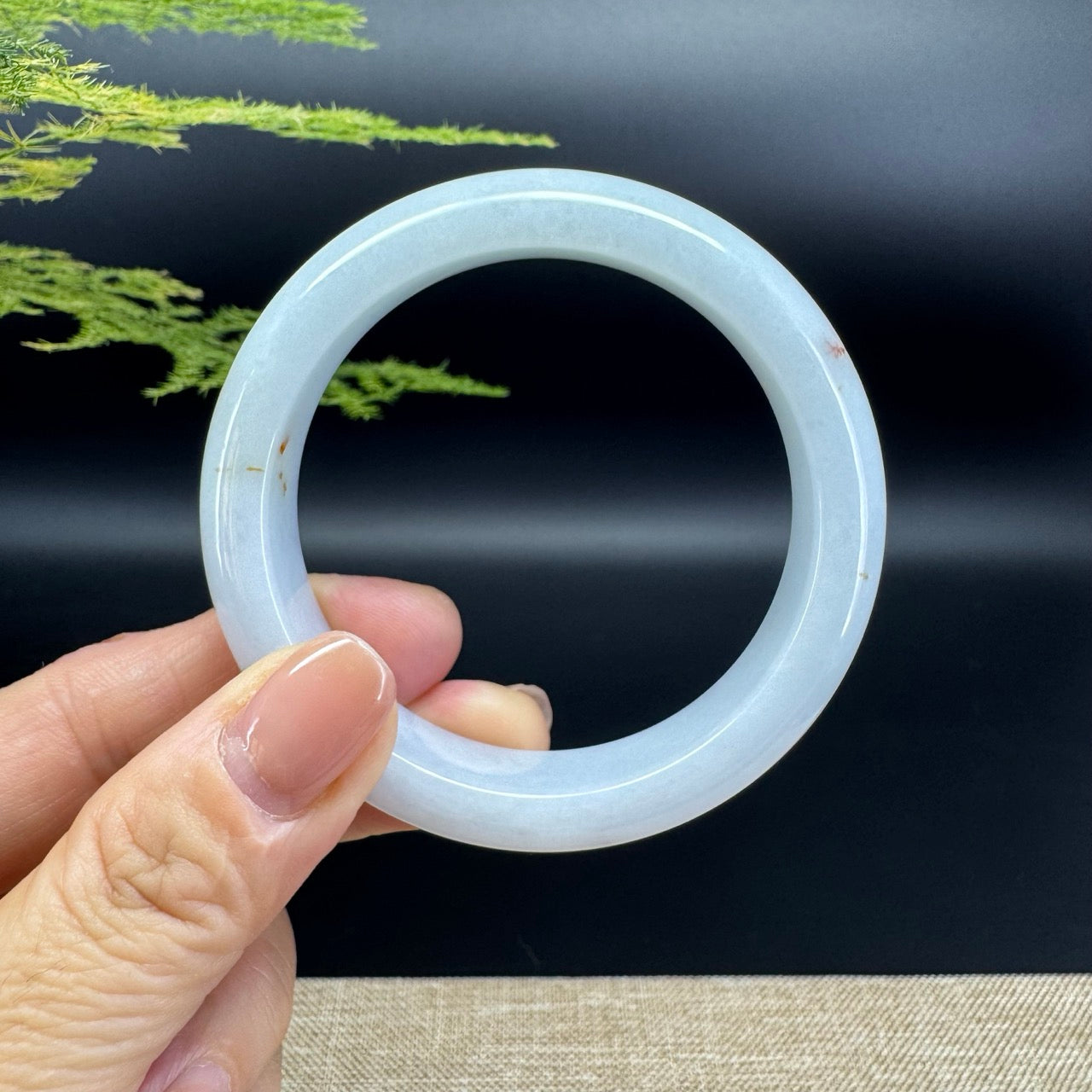 The bangle shape of the half round.The bangle color is icy green.