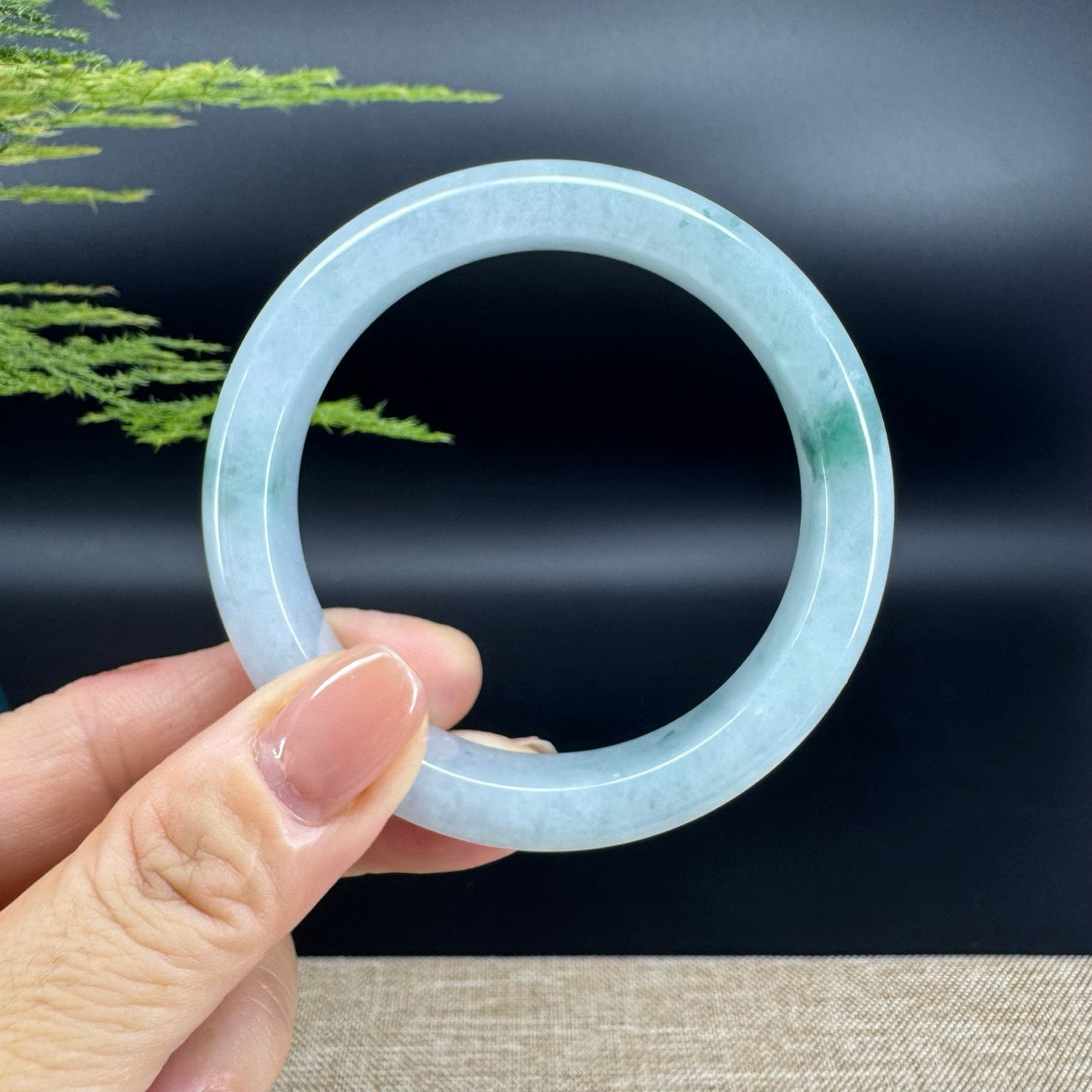 The bangle shape of the half round.The bangle color is icy green.