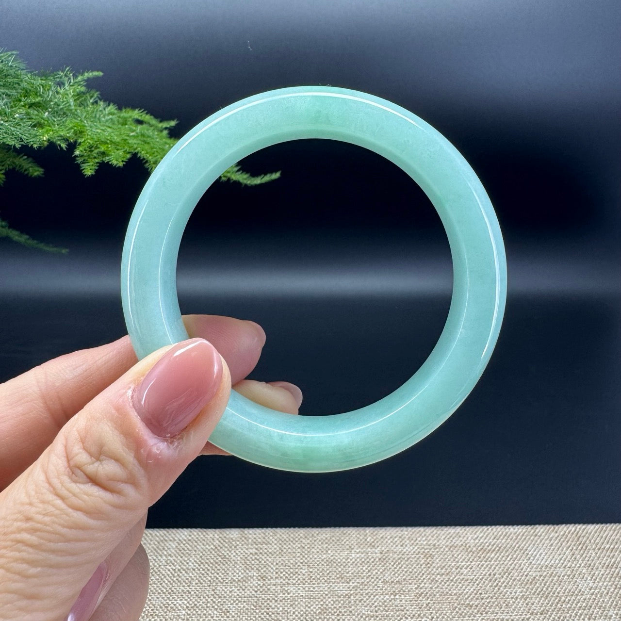 The bangle shape of the half round.The bangle color is apple green.