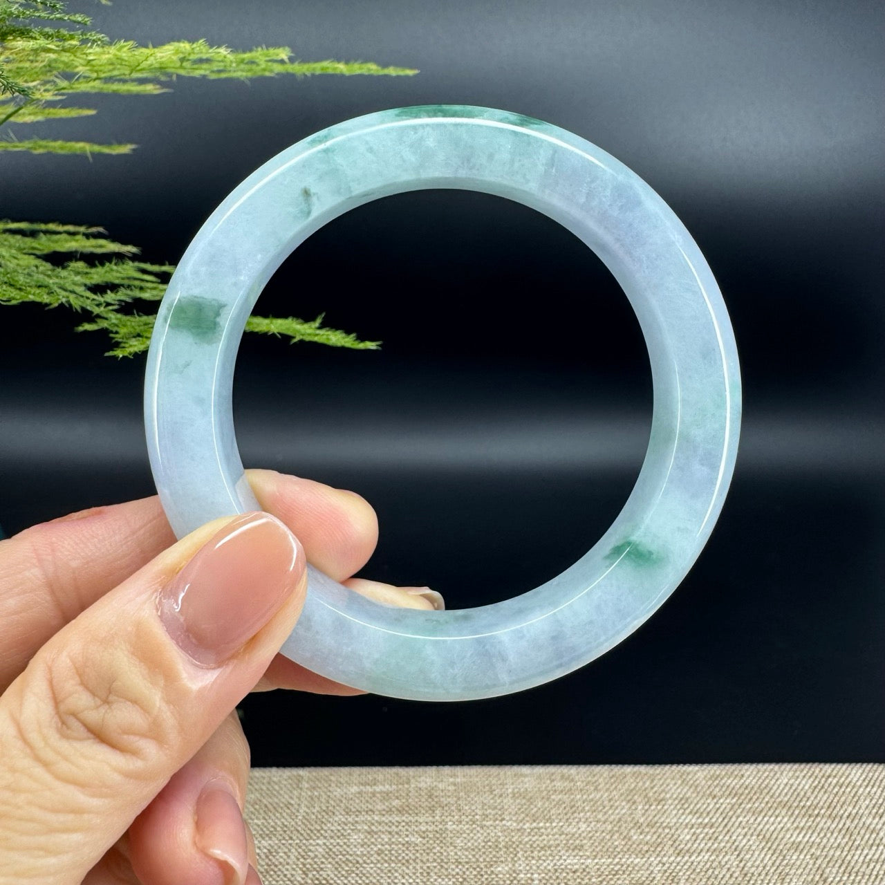 The bangle shape of the half round.The bangle color is icy green.