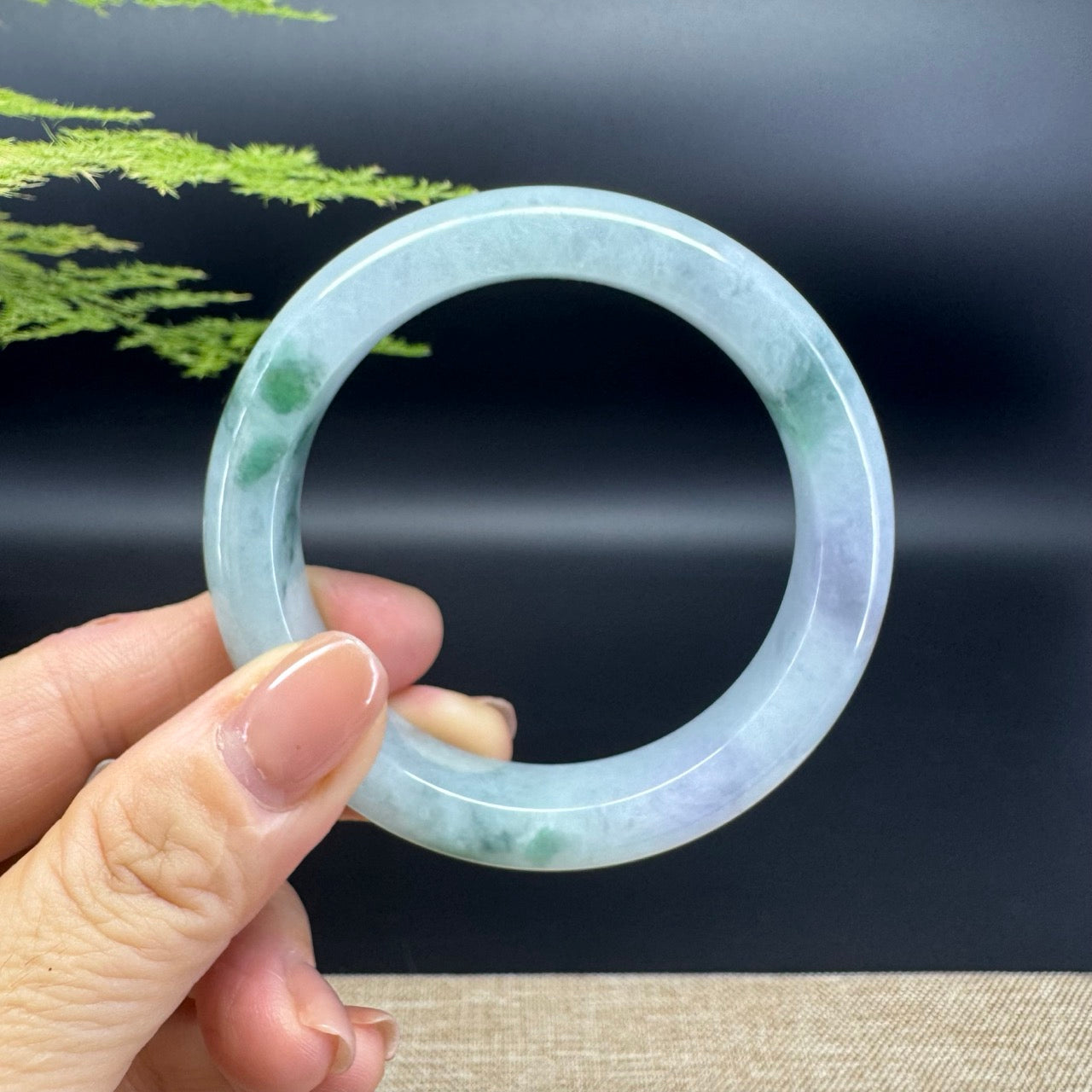 The bangle shape of the half round.The bangle color is icy lavender green.