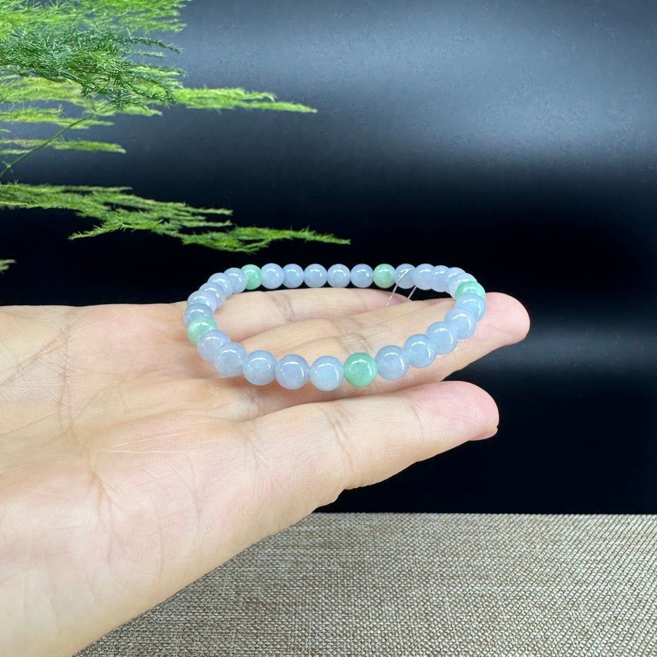 The beads shape of the round.The beads colors are lavender green.
