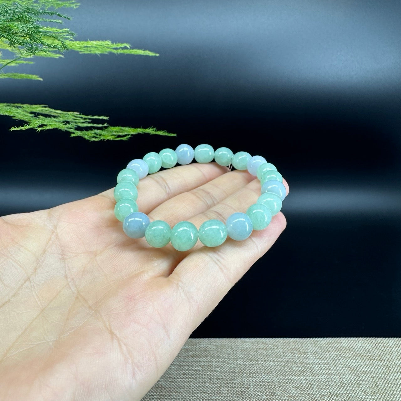The beads shape of the round.The beads colors are lavender green.