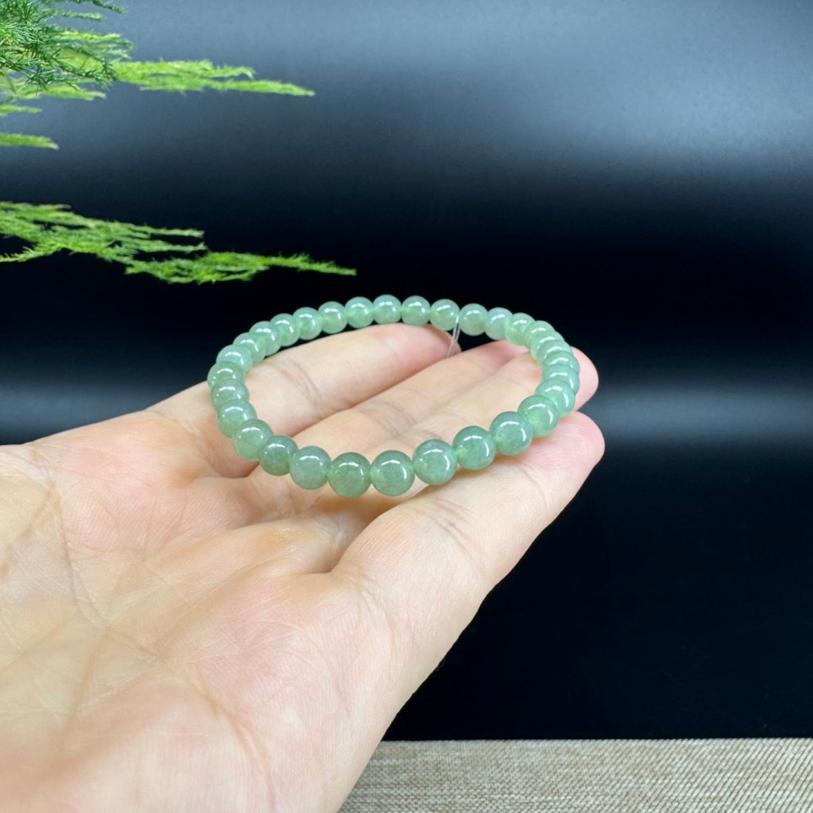 The beads shape of the round.The beads color is light green.