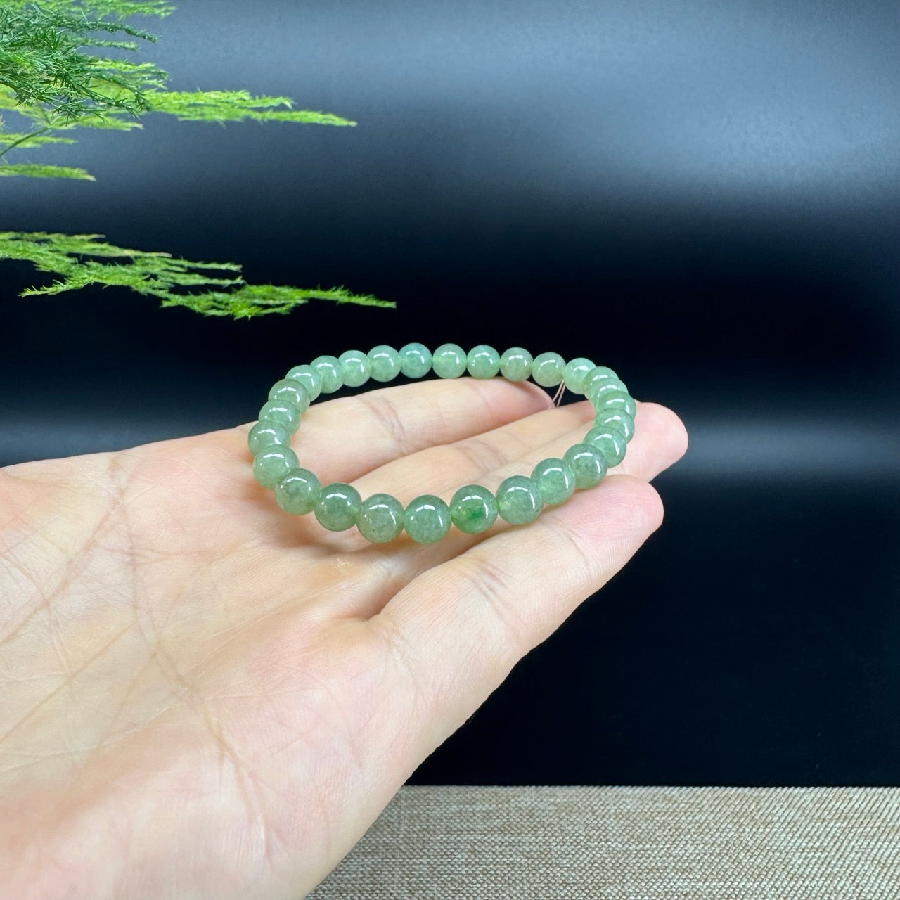 The beads shape of the round.The beads color is green.