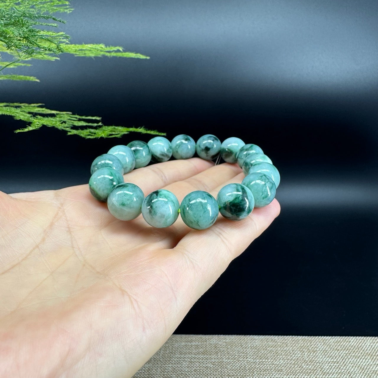 The beads shape of the round.The beads color is blue green.