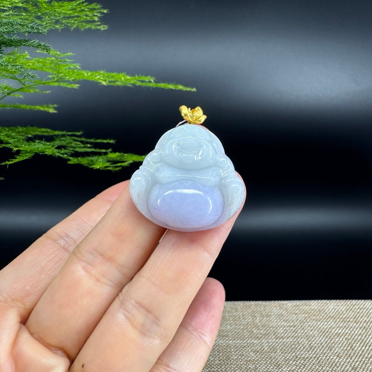 The pendant shape of the buddha.The pendant color is lavender.