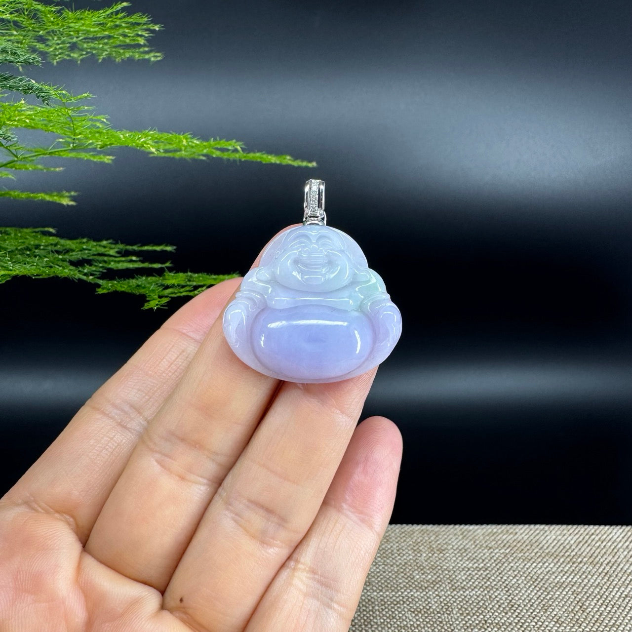 The pendant shape of the buddha.The pendant color is lavender.