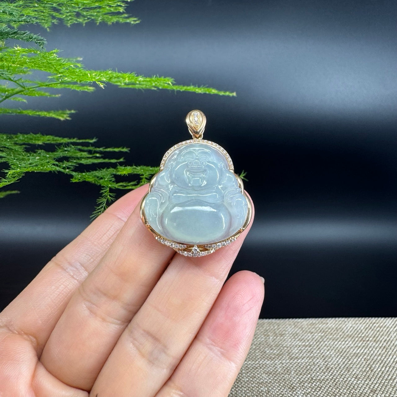The pendant shape of the buddha.The pendant color is icy.