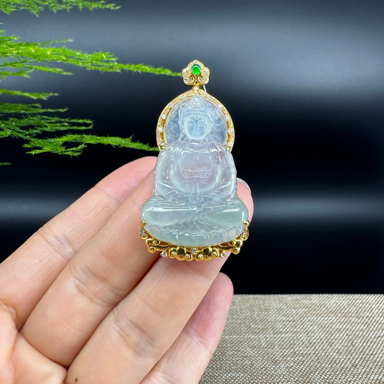 The pendant shape of the guanyin.The pendant color is icy.
