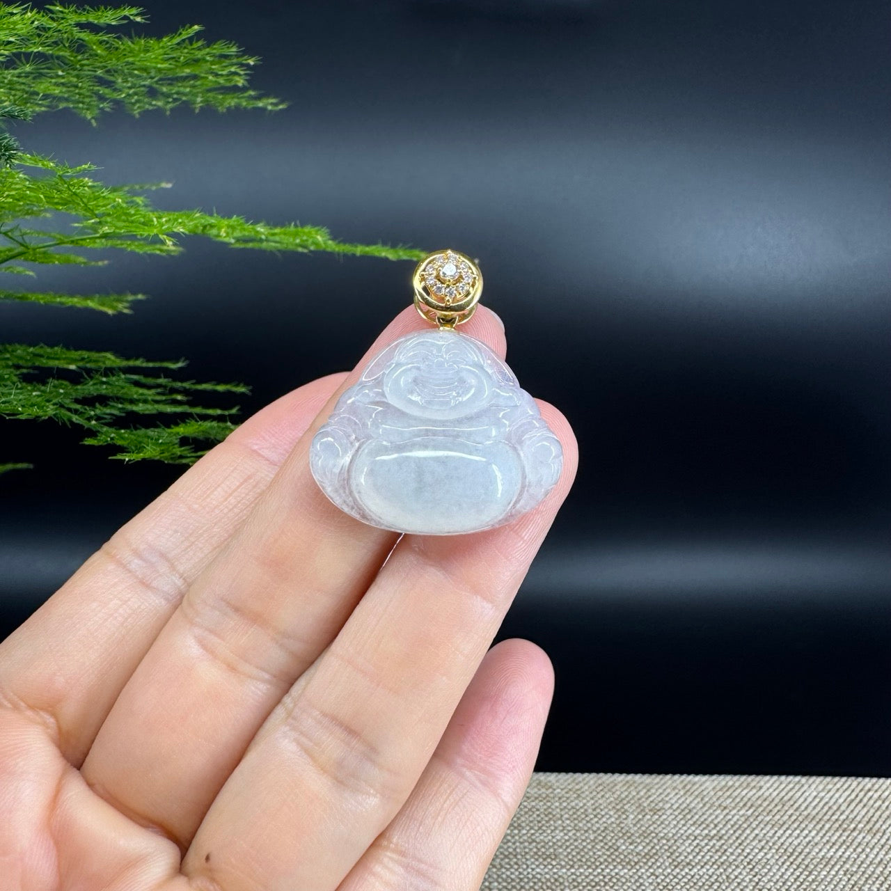 The pendant shape of the buddha.The pendant color is icy.