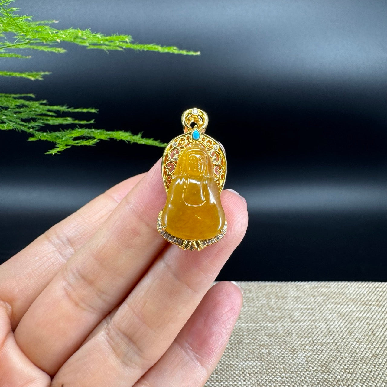 The pendant shape of the guanyin.The pendant color is honey yellow.
