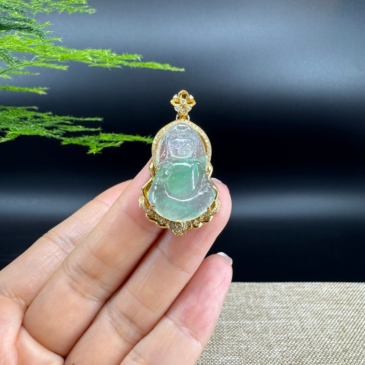 The pendant shape of the guanyin.The pendant color is icy apple green.
