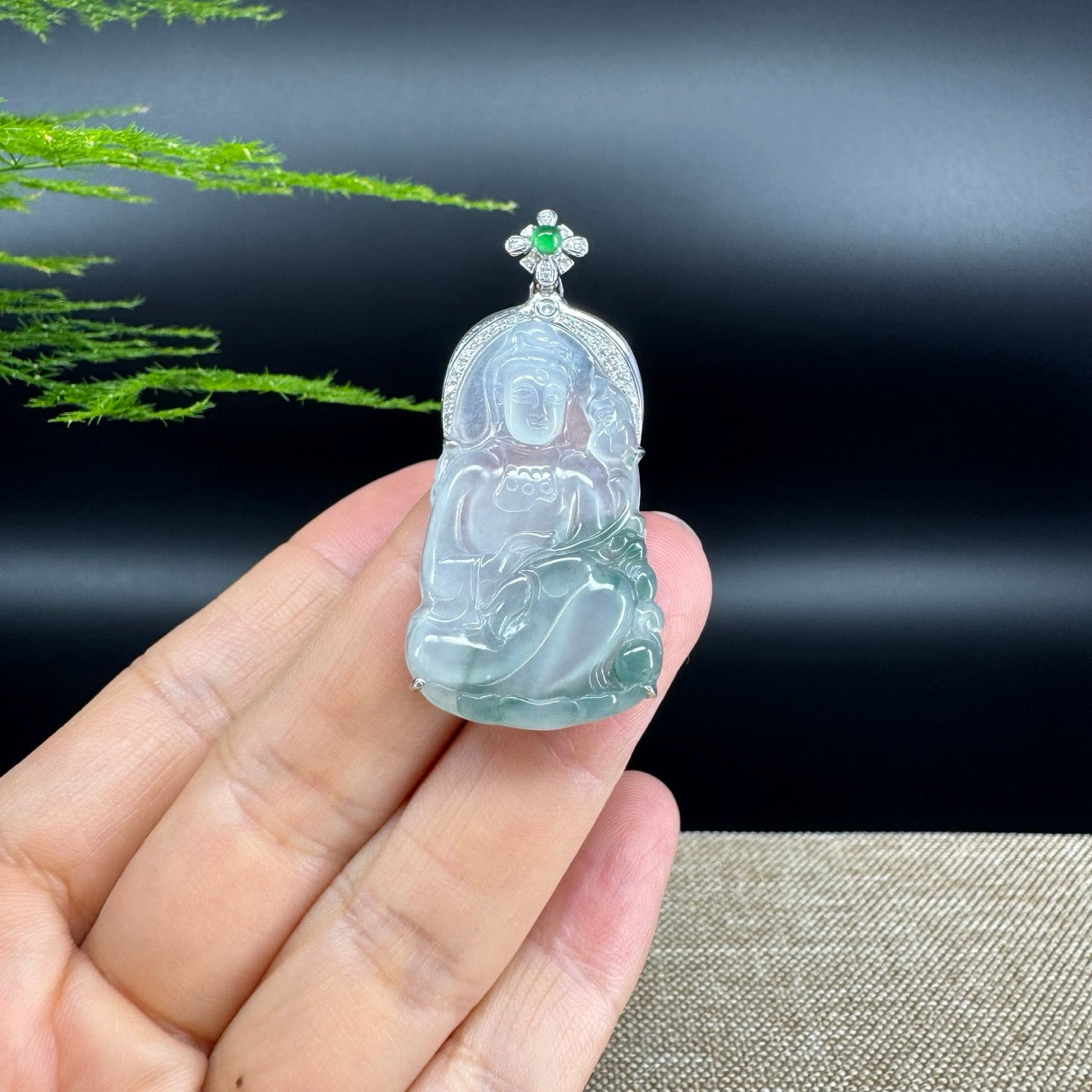 The pendant shape of the guanyin.The pendant color is icy green.