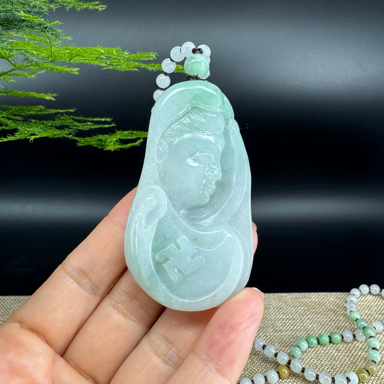 The pendant shape of the guanyin.The pendant color is icy green.