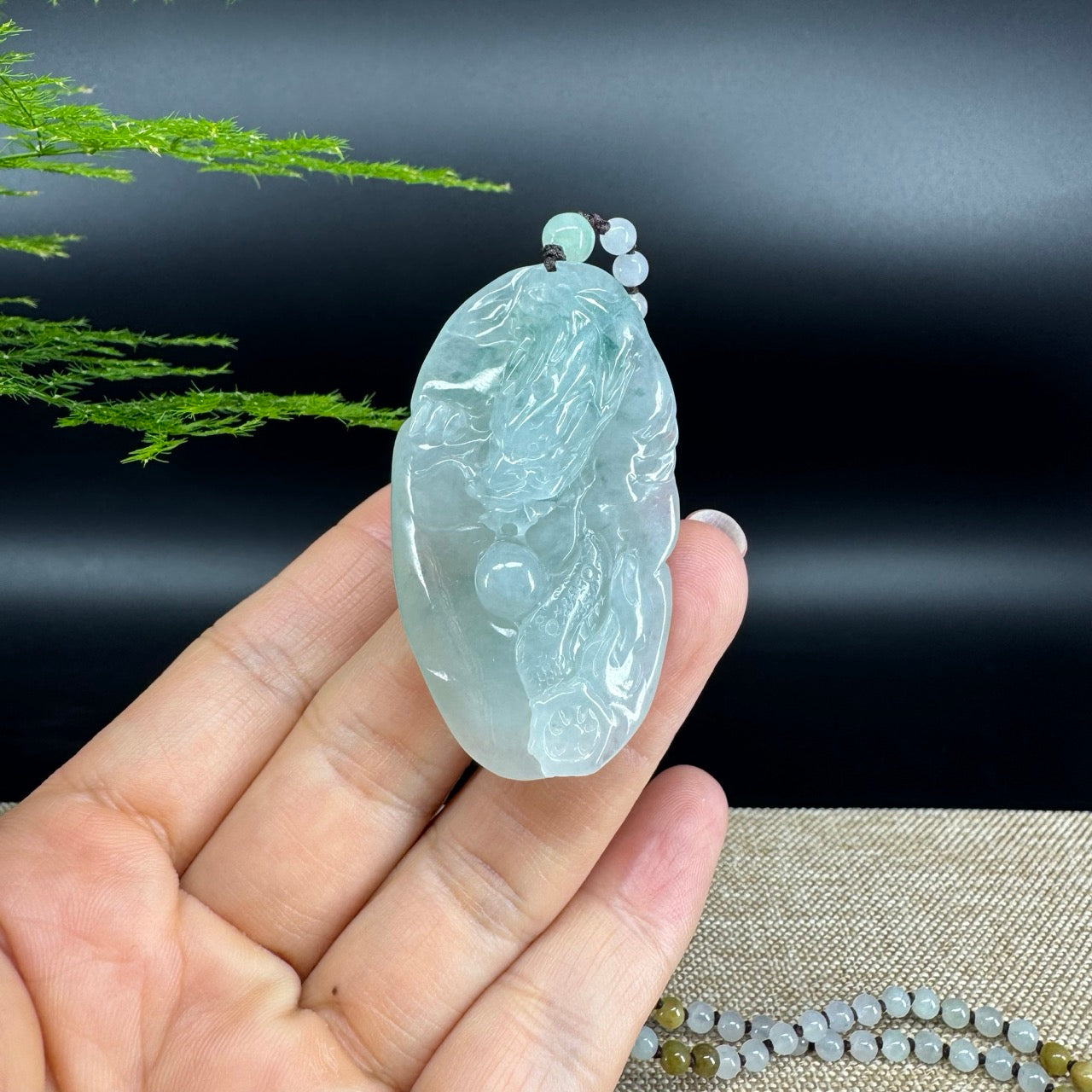 The pendant shape of the dragon.The pendant color is icy blue.