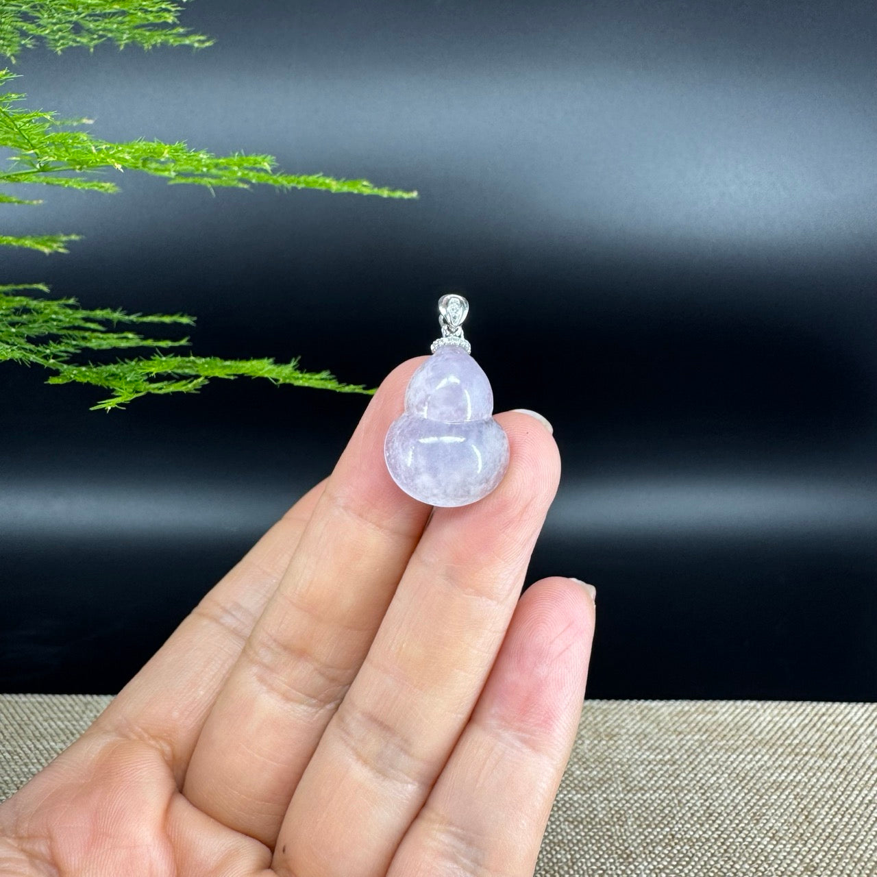 The pendant shape of the hulu.The pendant color is icy lavender.