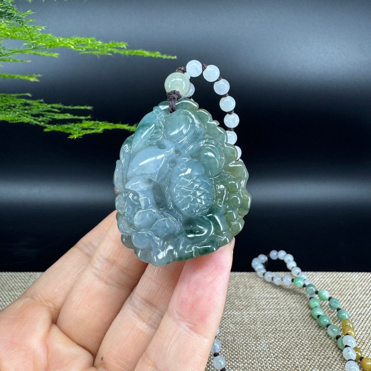 The pendant shape of the fish.The pendant color is blue green.