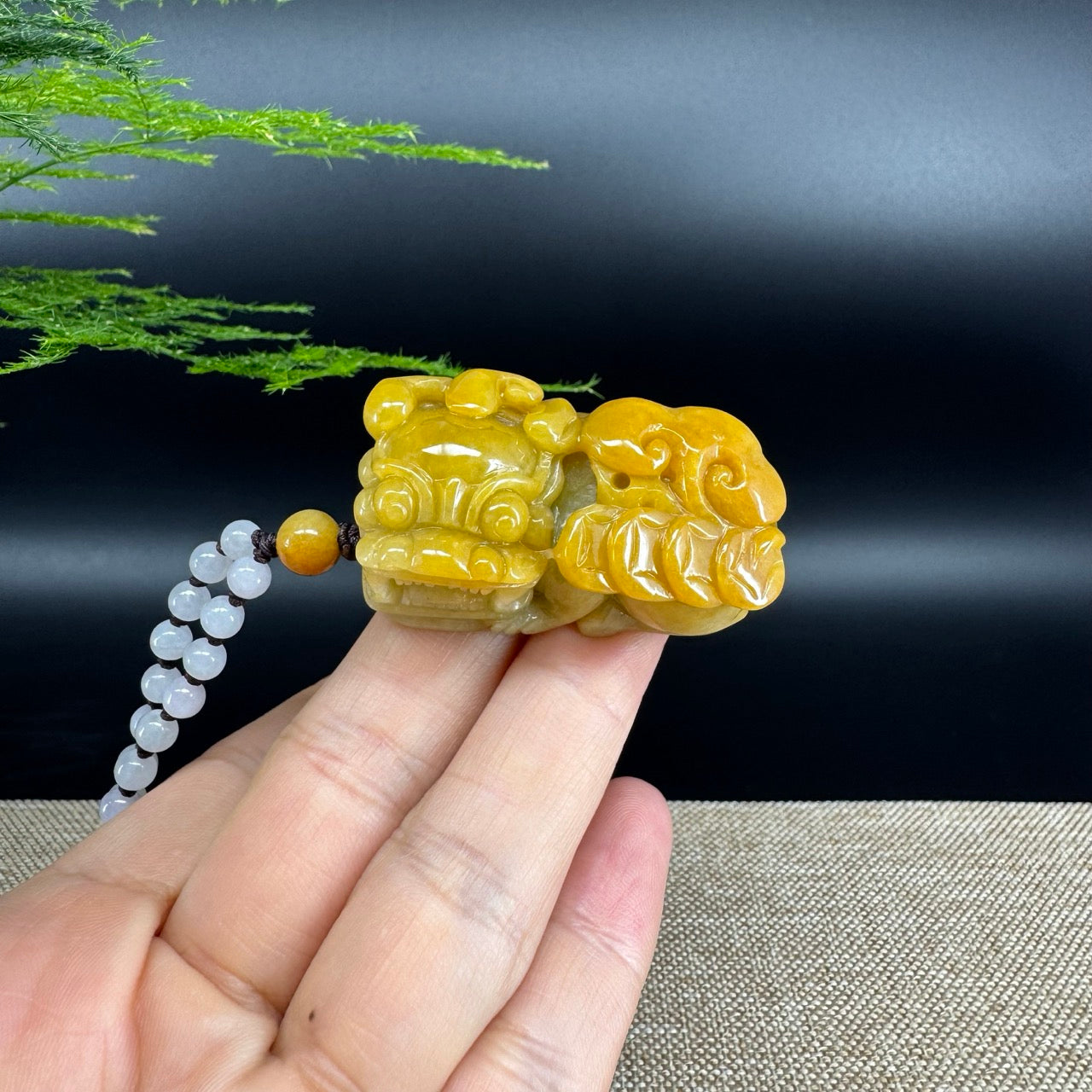 The pendant shape of the pixiu.The pendant color is yellow.