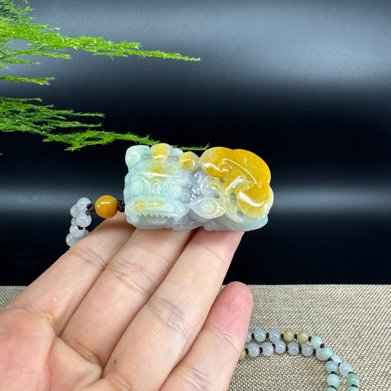 The pendant shape of the pixiu.The pendant color is yellow green.