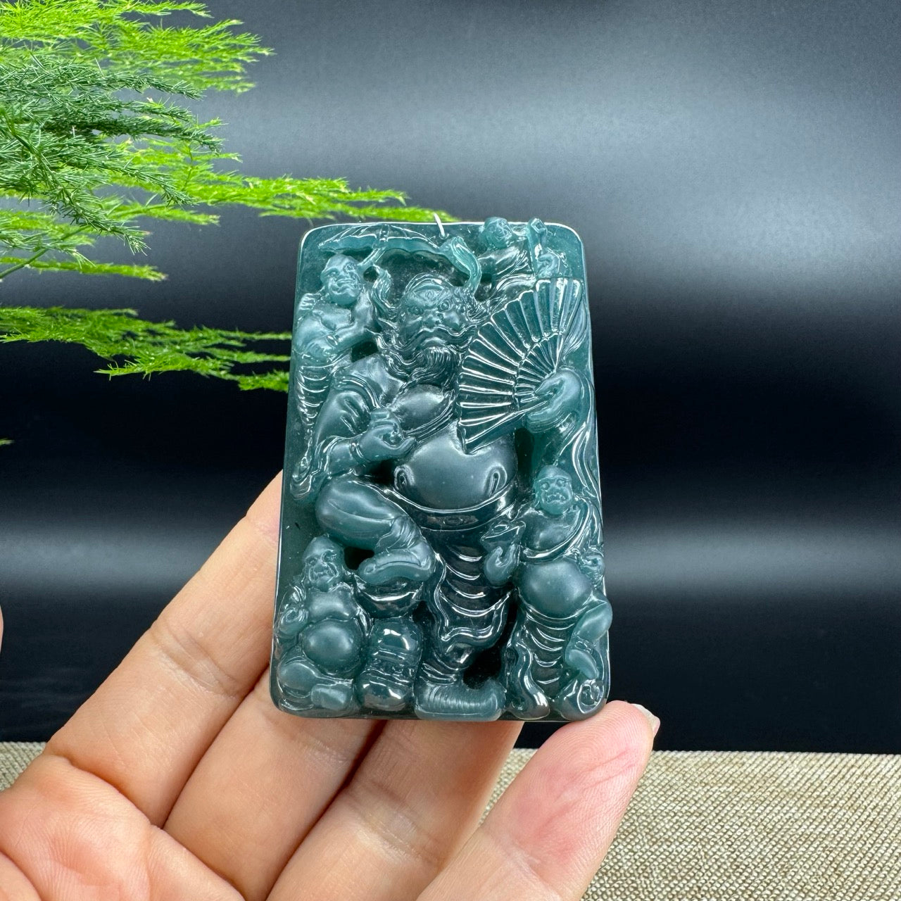 The pendant shape of the zhongkui.The pendant color is icy blue.