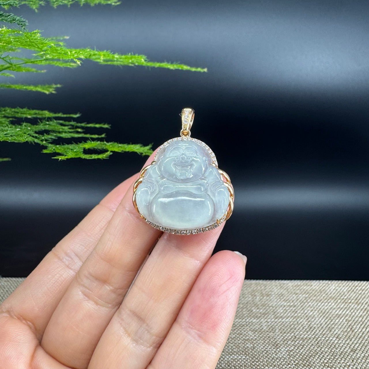 The pendant shape of the buddha.The pendant color is icy.