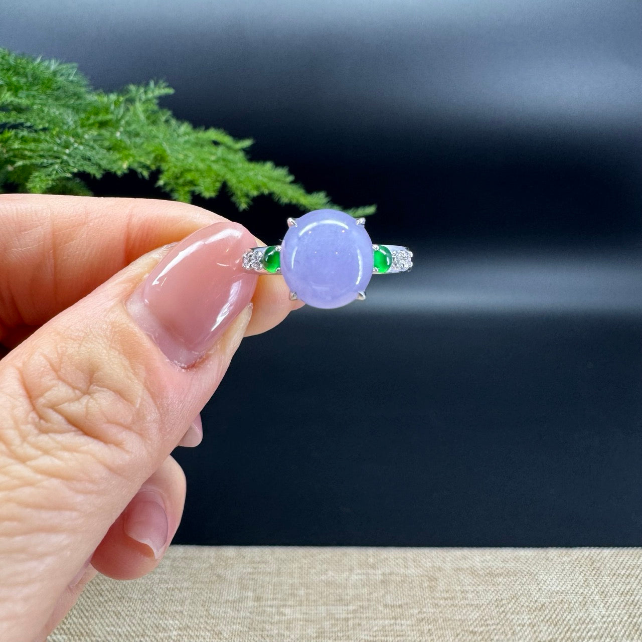 The shape of the ring is round.The ring color is lavender.