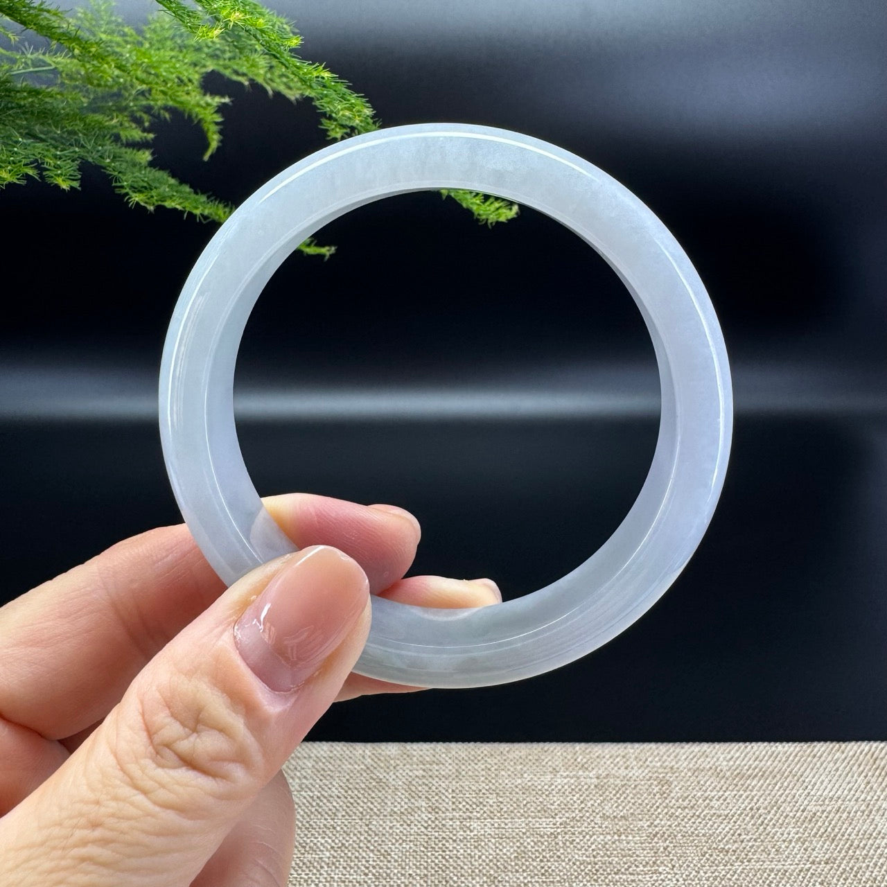 The bangle  shape of the half round.The bangle color is lavender.