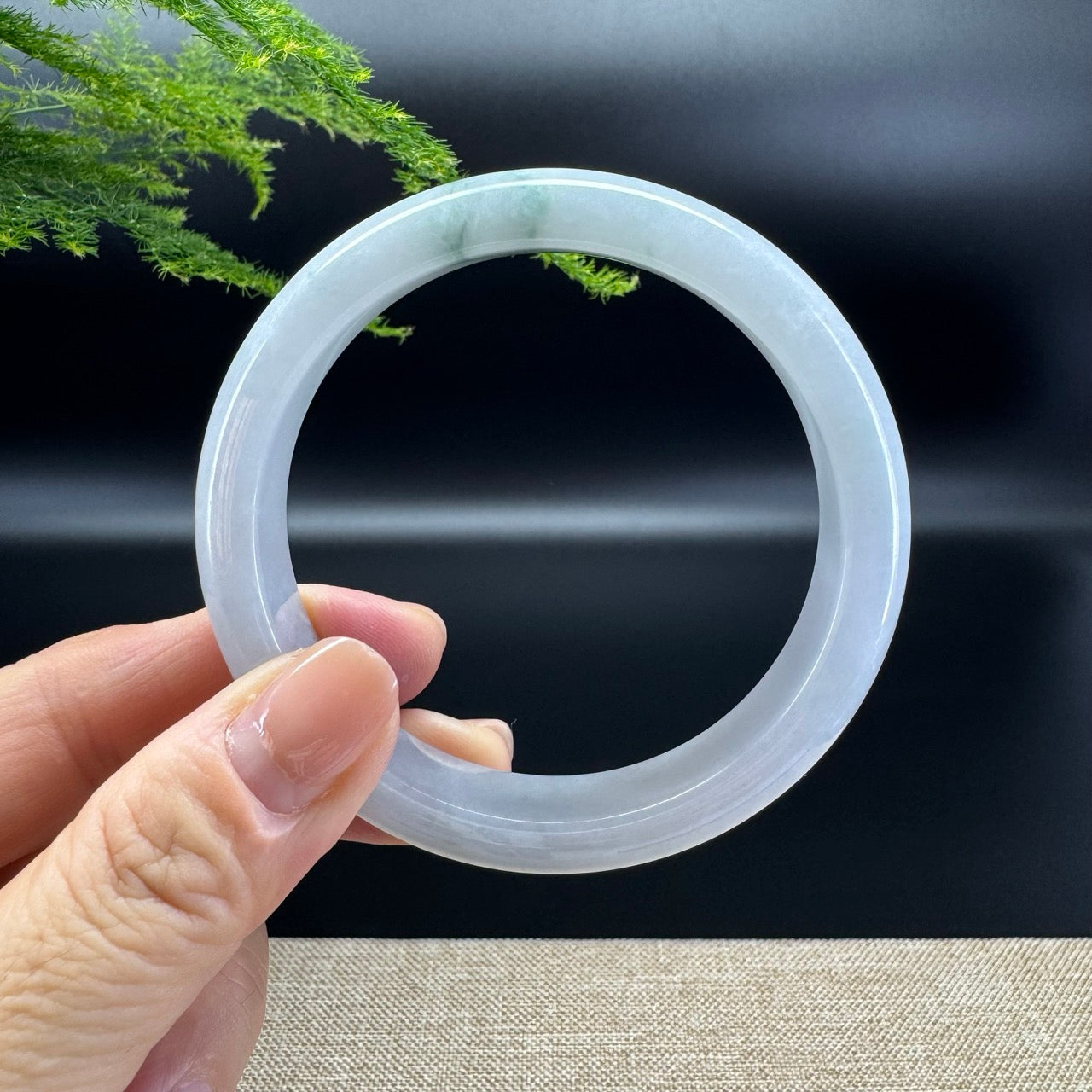 The bangle shape of the half round.The bangle color is icy green.
