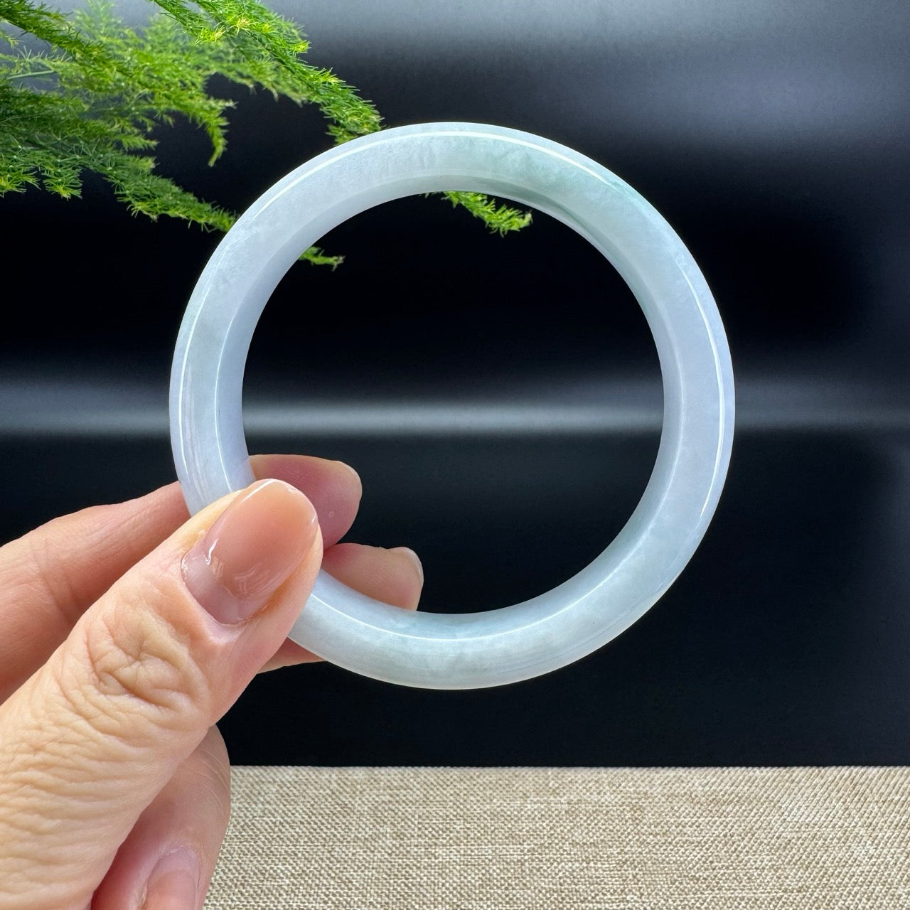 The bangle shape of the half round.The bangle color is icy lavender green