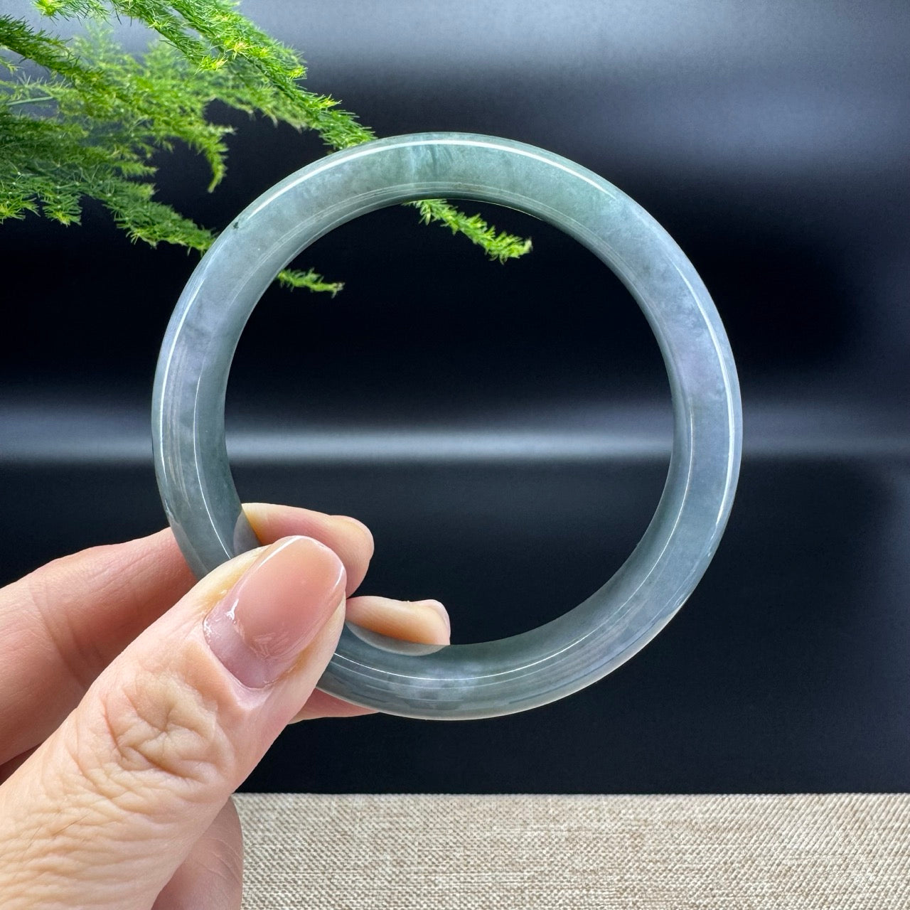 The bangle shape of the half round.The bangle color is lavender green.