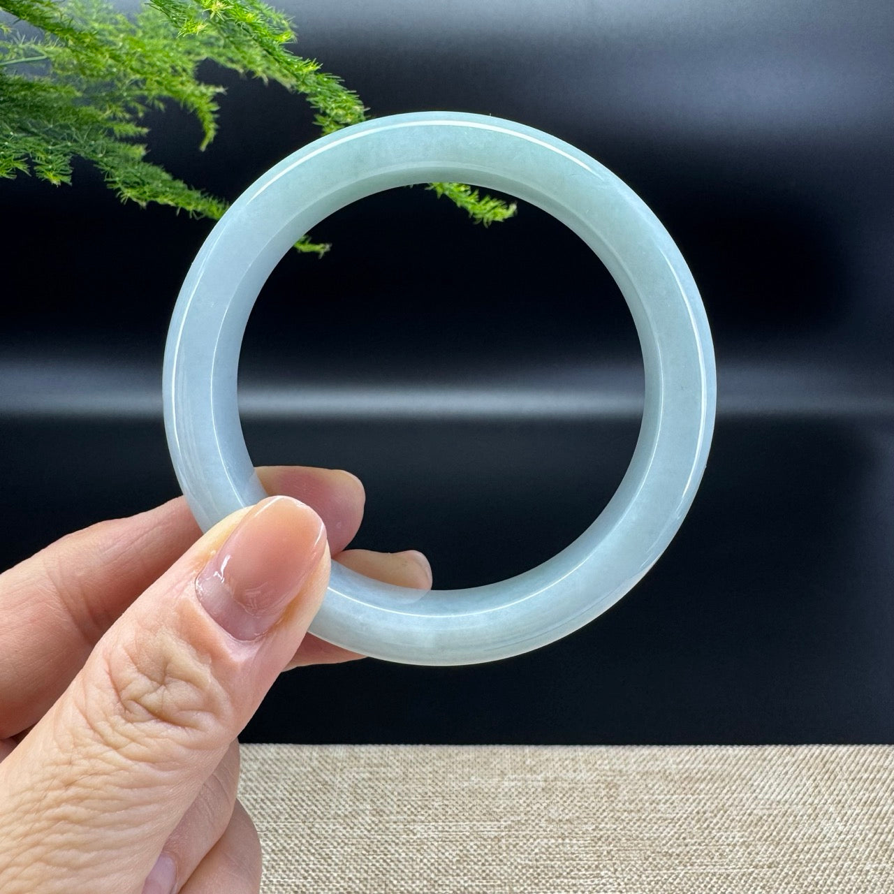 The bangle shape of the half round.The bangle color is green.