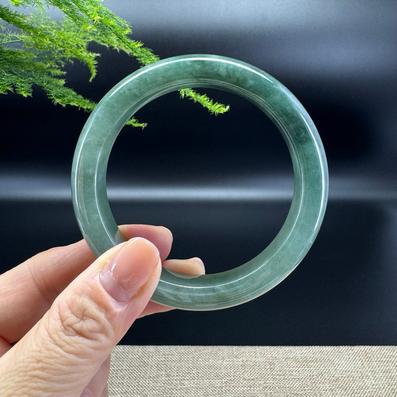 The bangle shape of the half round.The bangle color is oil green.