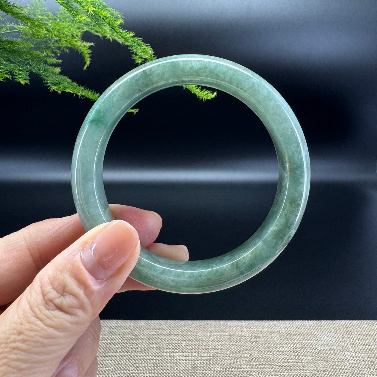 The bangle shape of the half round.The bangle color is oil green.