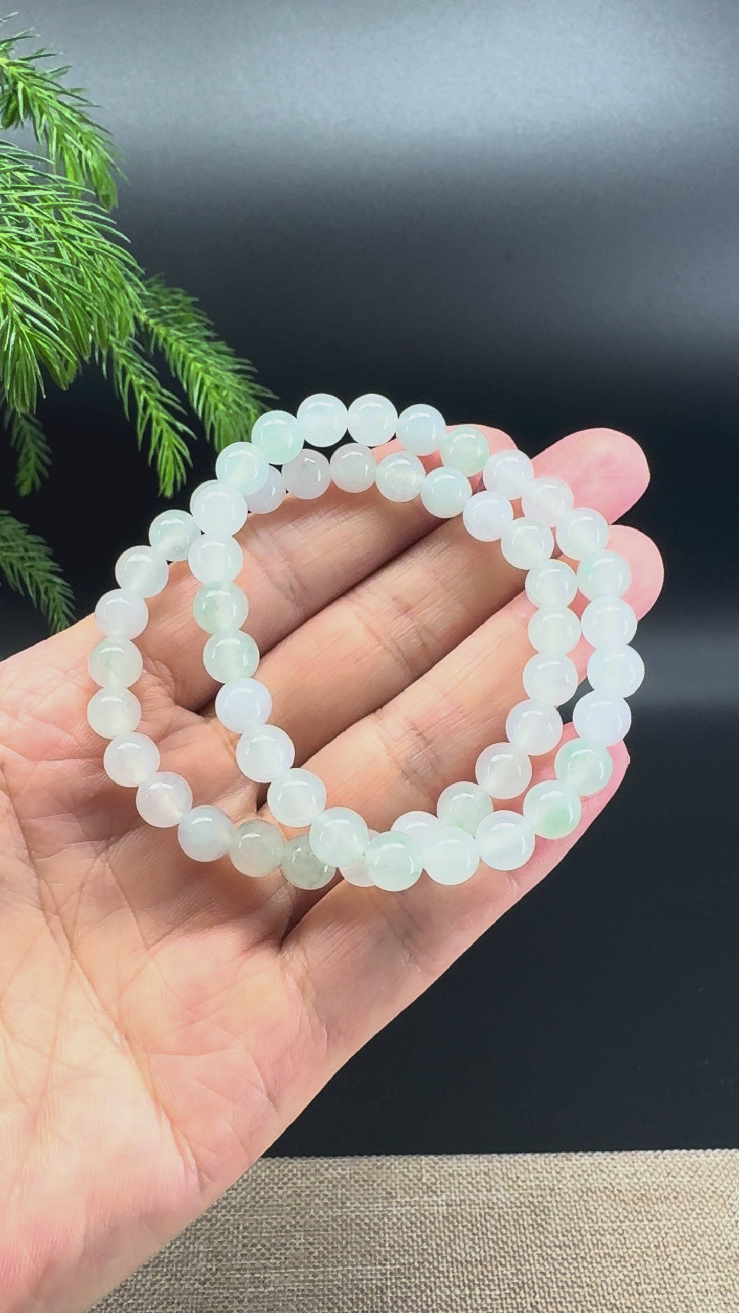 Load and play video in Gallery viewer, RealJade® Co. Genuine Jadeite Jade Round Icy Green Beads Bracelet (6.9mm)
